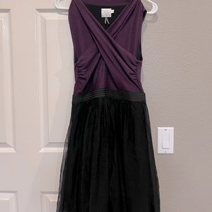 Purple and black cross cross front dress with empire waist and tutu skirt